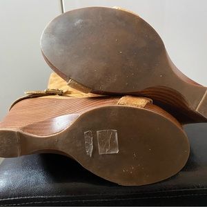 Tan suede boots, zip up on inner side of boot. 4 buckles. Condition almost new.